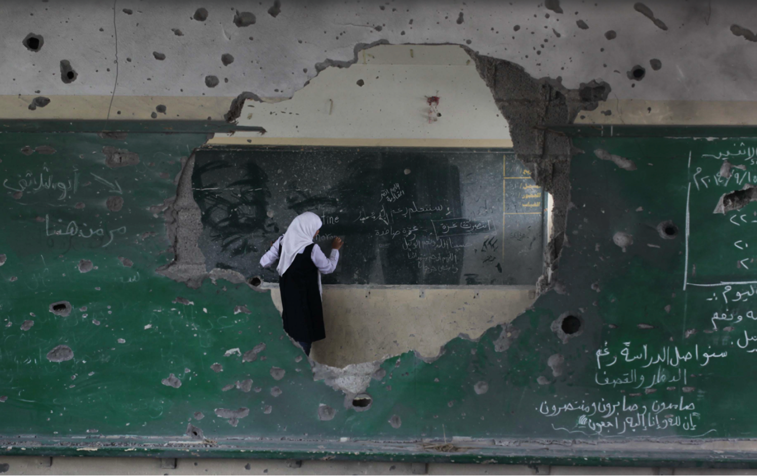 The beginning of the fall school term in the al-Sheiaeiya neighborhood of Gaza City after a  three-week delay due to damage from a large-scale Israeli offensive. Ashraf Amra/ APA, 2014. 