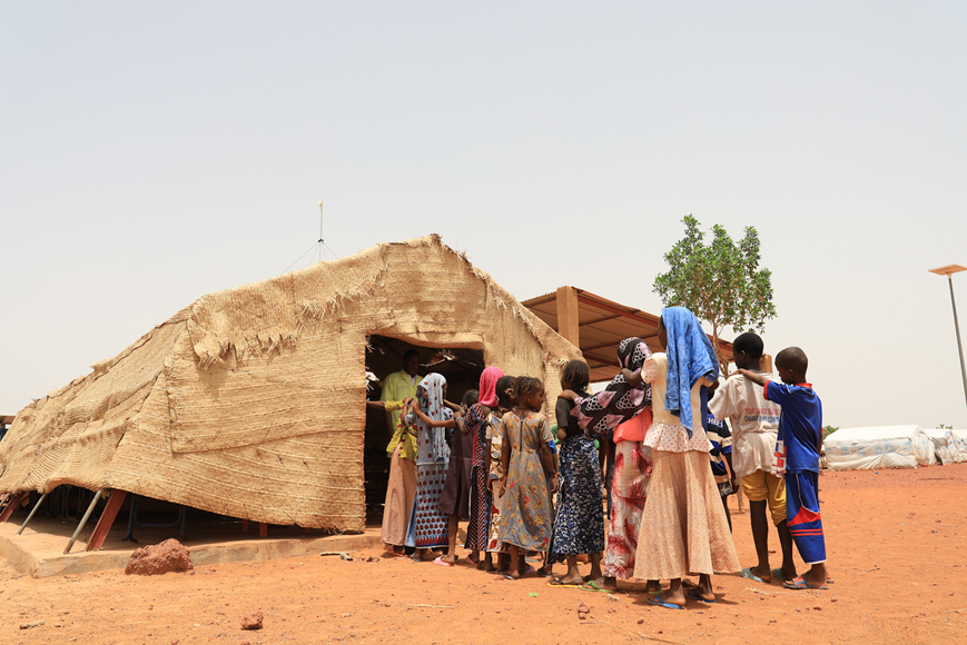 This image shows a canvas and tent-like Temporary Learning Space that has been set up through the EMPOWER project in a camp for internally displaced persons in Mopti region.  Photo credit: Ismaël Diallo