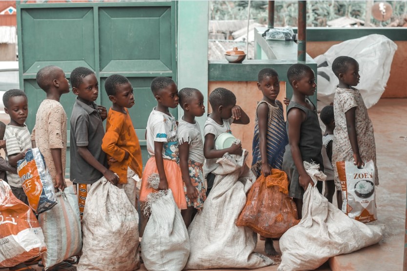 Refugee children lined up outside of school