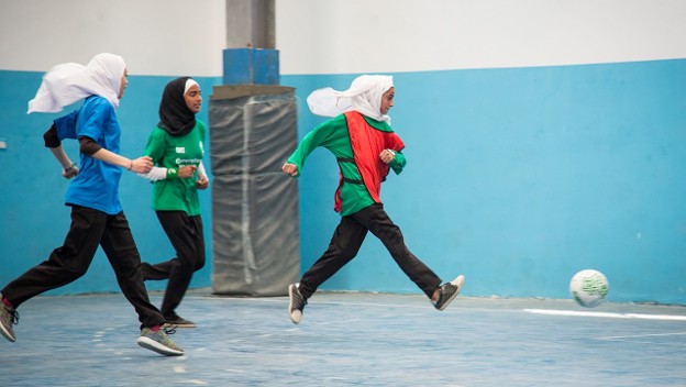 Three girls playing soccer, Jordan, 2017| Credit: Paul Bettings, Right To Play 