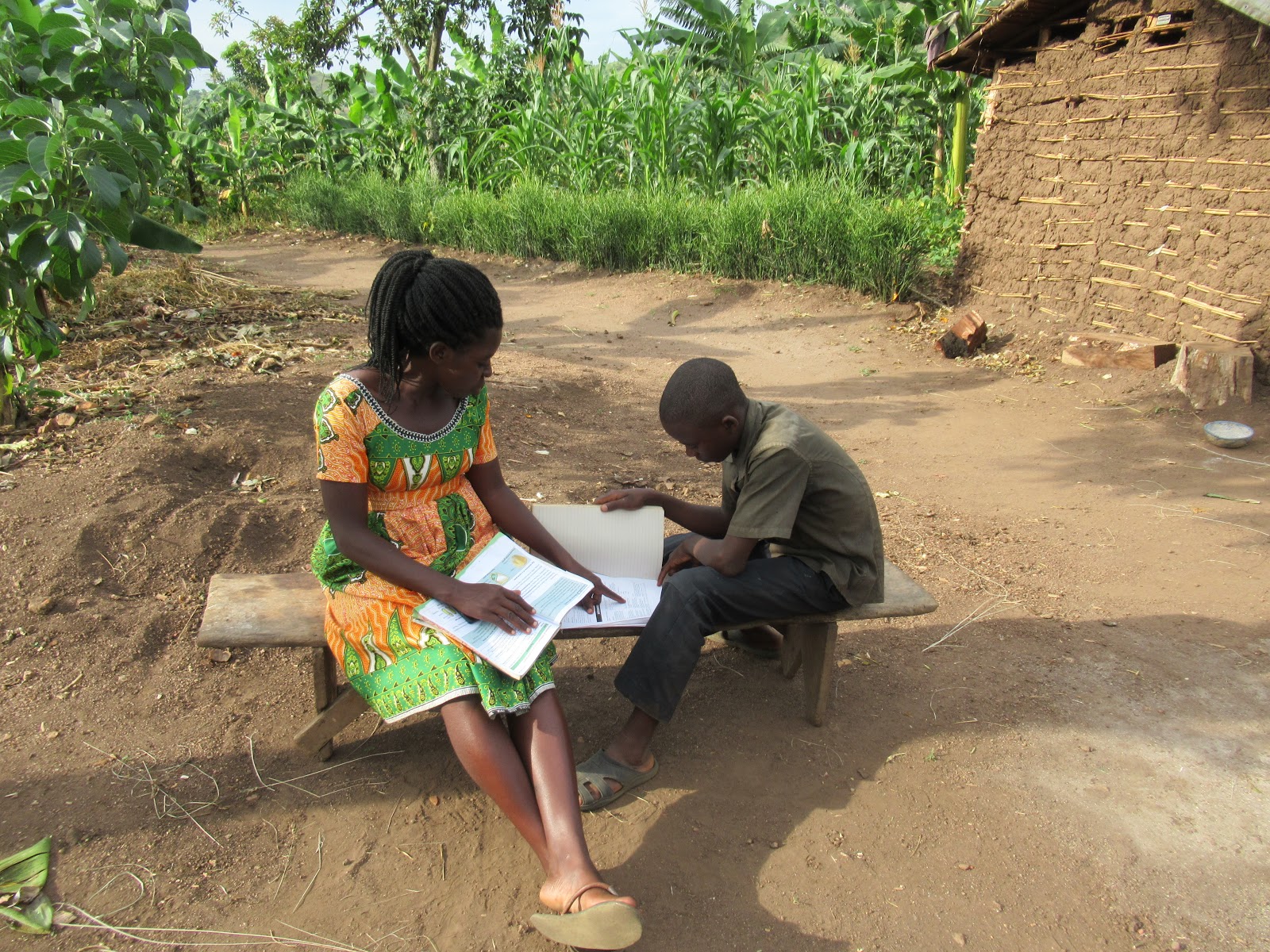 Teacher Brenda visits learners at home in Rwamwanja refugee settlement, Uganda. Credit: Save the Children