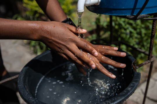 Beauty (17) washes her hands at her school in Zambia during the country's worst cholera outbreak in 20 years. © Sacha Myers / Save the Children